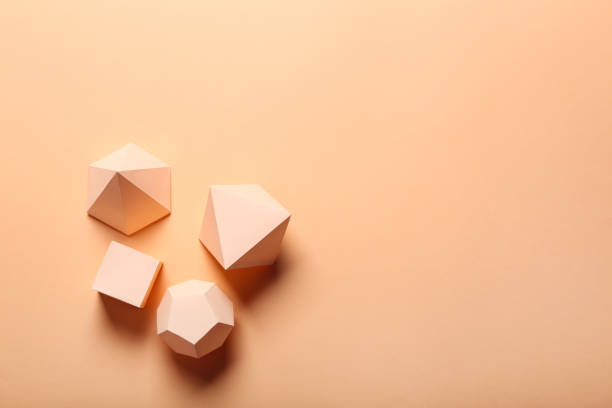 istock Paper geometric figures on beige background 1205693905