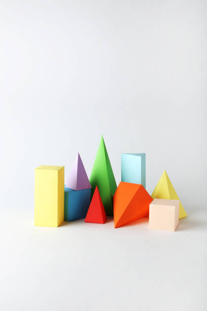 istock Colorful paper geometric figures on gray background 1205693923