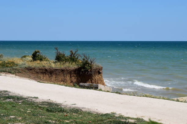 istock Seascape with steep clay cliff 1205694008