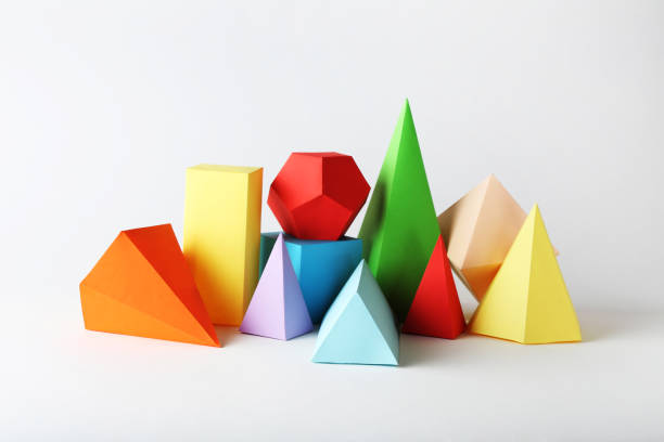 istock Colorful paper geometric figures on gray background 1205694012