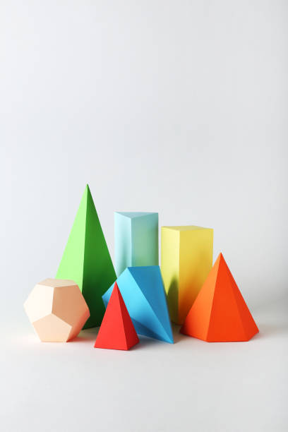 istock Colorful paper geometric figures on gray background 1205694036