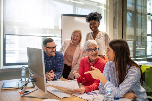 istock Image of business partners discussing documents and ideas at meeting. 1205694592