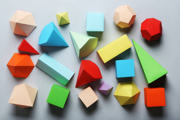 istock Colorful paper geometric figures on gray background 1205694628