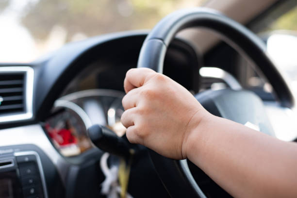 istock Close up hand woman driver. 1205702679