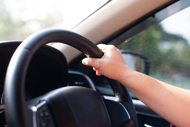 istock Close up hand woman driver. 1205702685