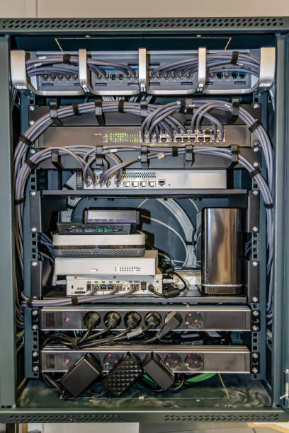 istock Network server rack with colored cables and ethernet switches in the data center. Technology concept 1205703530