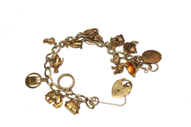 istock A Gold Charm Bracelet Jewellery On White Background 1205703665
