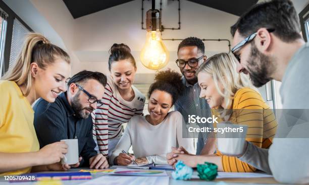 Young Creative Business People Meeting At Office Stock Photo - Download Image Now - Teamwork, Young Adult, Working