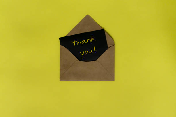 istock Thank You Card on yellow background 1205710553