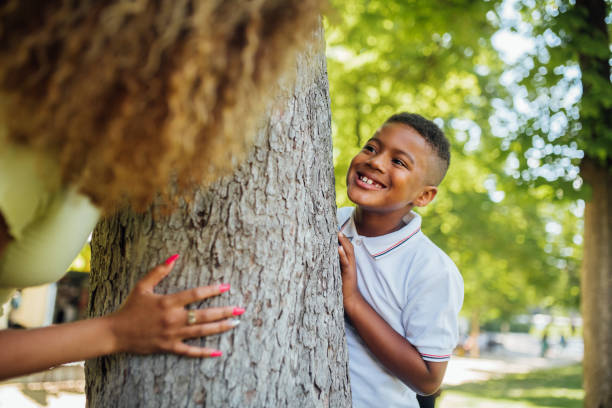 istock Boy playing with his mom in the park 1205713121