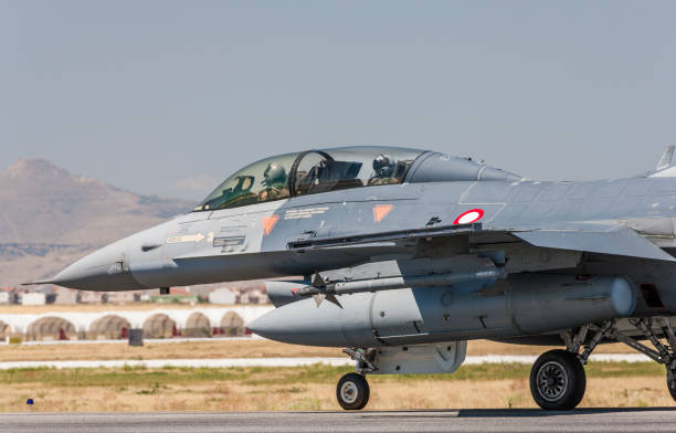 istock F-16 Fighting Falcon fighter plane on runway 1205714850