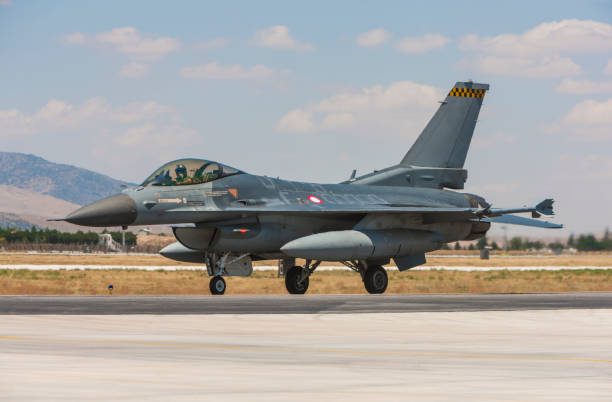 istock F-16 Fighting Falcon fighter plane on runway 1205714873
