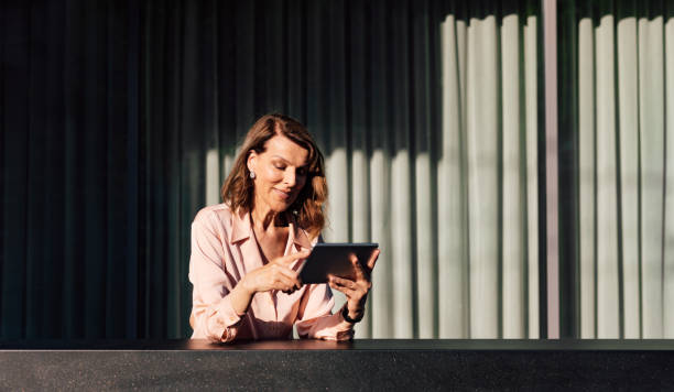 istock Pretty Senior Businesswoman Working at her Office 1205716193
