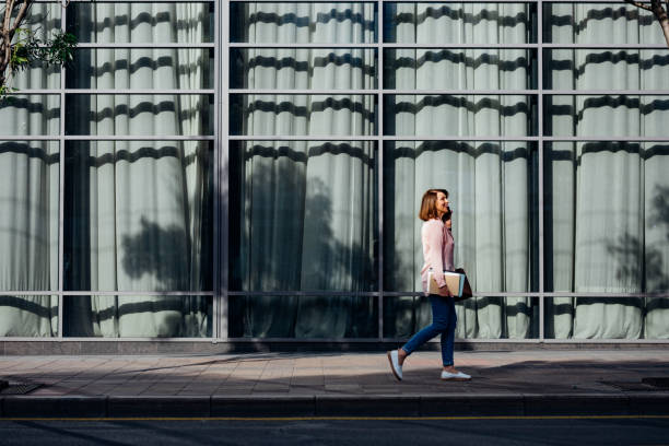istock A Woman Walking at the City 1205716270