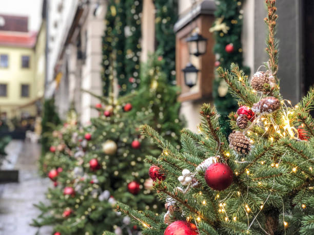 istock decorated pine tree at street for new year 1205716292