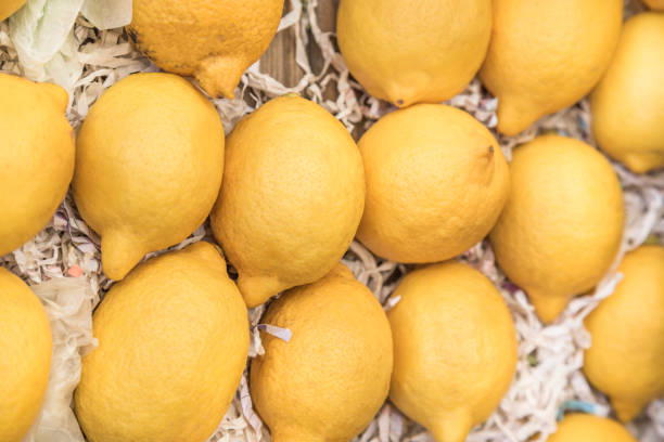 istock fresh and ripe lemons as a background 1205716335