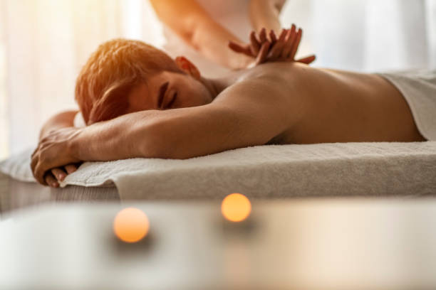 istock Man receiving back massage from masseur. 1205716544