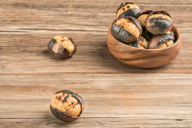 istock roasted chestnuts in a bowl on a wooden 1205718002