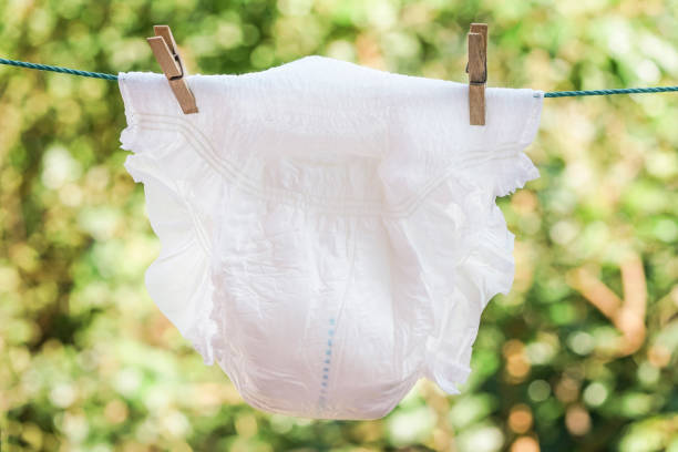 diaper for adults hanged on rope a diaper for adults hanged on rope adult diaper stock pictures, royalty-free photos & images