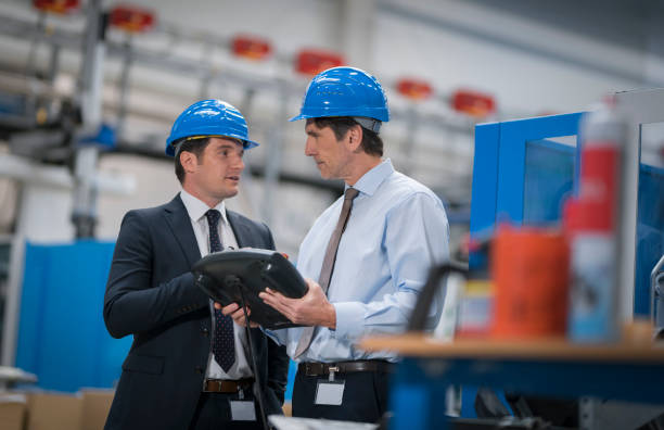 istock Manager and engineer discussing in factory 1205718864