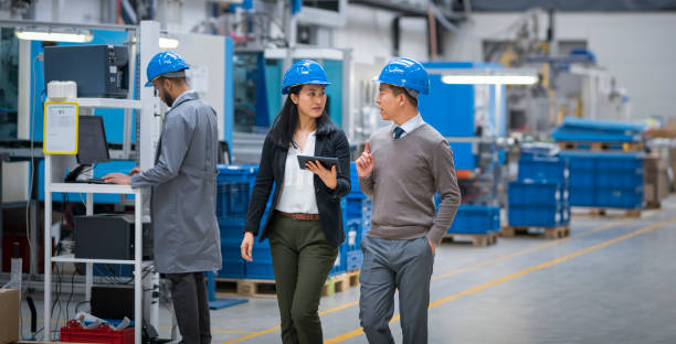 istock Engineers discussing in factory 1205718888