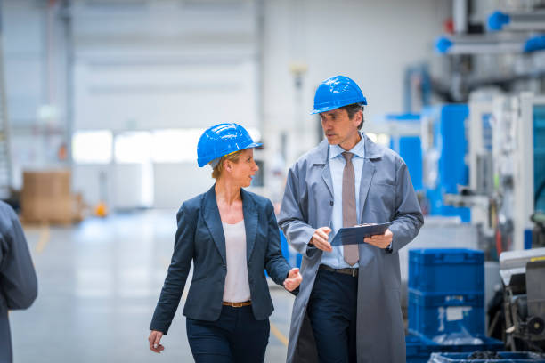 istock Manager and engineer discussing in factory 1205718931