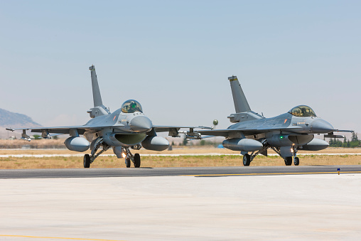 Two F-16 fighter planes on runway