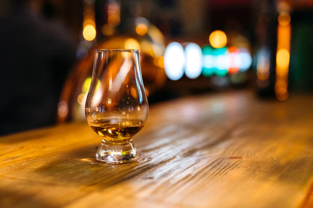 istock Glass of whiskey on bar counter 1205720921