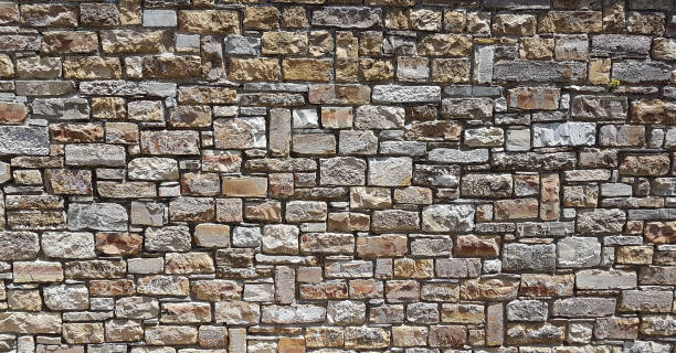 istock part of a stone wall, for background or texture. 1205722365
