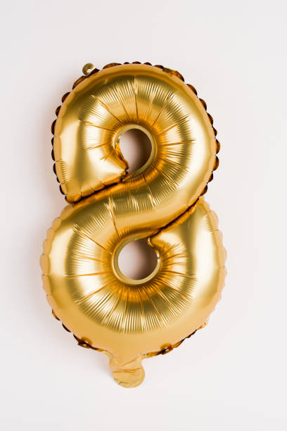 istock Decorative golden balloon in shape of eight on grey background 1205722552