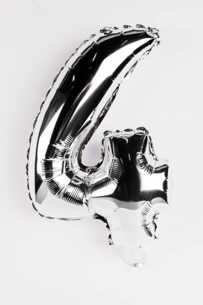 istock Festive silver balloon in shape of four number on grey background 1205722619