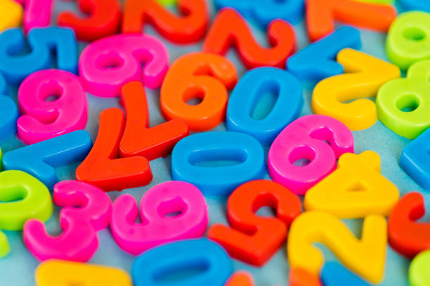 istock Selective focus of colorful plastic numbers on blue surface 1205722745
