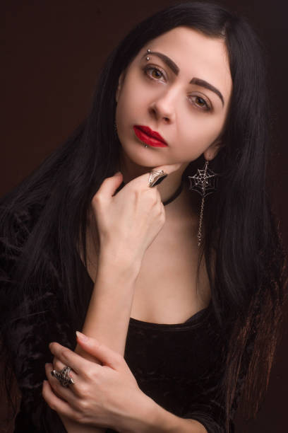 istock brunette on dark background dressed in goth style 1205724427