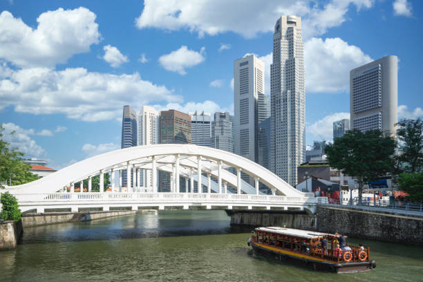 istock Traditional boat for tourism in Singapoer with bridge 1205727093