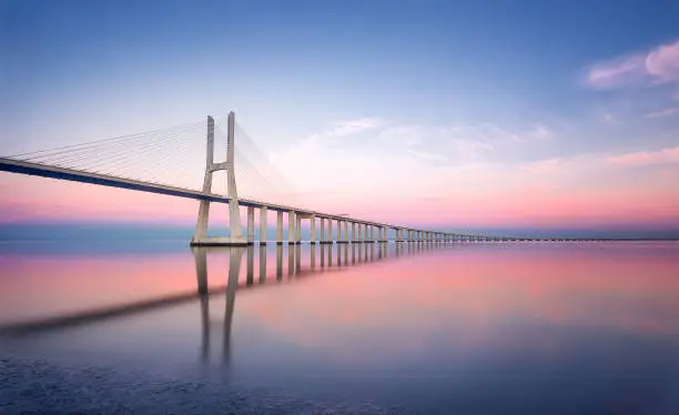 Photo of Portugal, Lisbon - Vasco da Gama bridge in Lisbon at sunset. Europe.