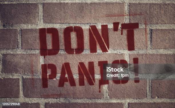 Dont Panic Stencil Spraypainted On Brick Wall Stock Photo - Download Image Now - Terrified, Street Art, Infectious Disease