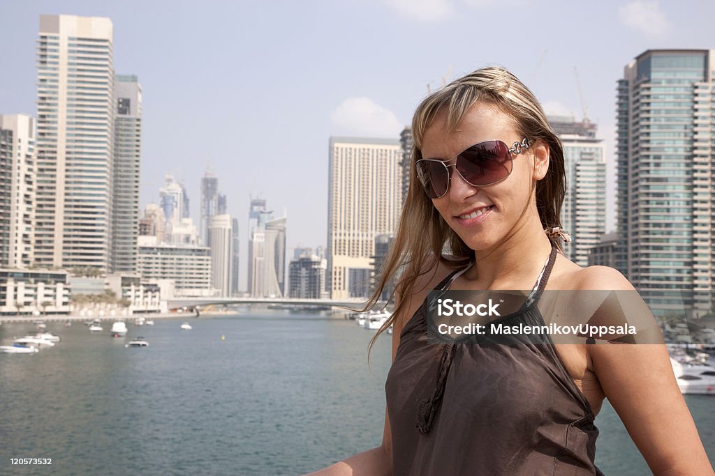 Dubai Marina Woman in Dubai Marina area in Dubai. Adult Stock Photo