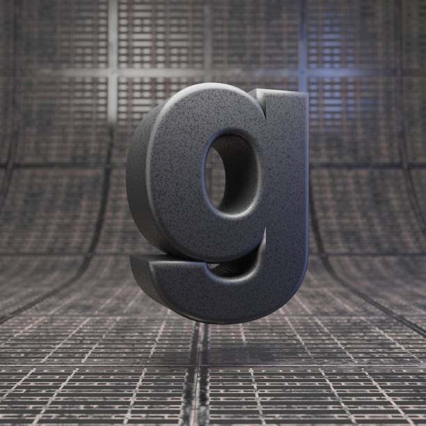 istock Black letter G lowercase. DLSR camera body plastic texture alphabet on metal floor. 1205736382