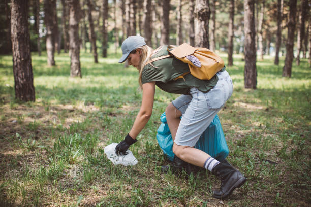 istock Volunteer cleaning park 1205737235