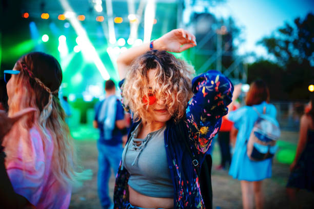 istock Dancing at summertime music festival 1205738688