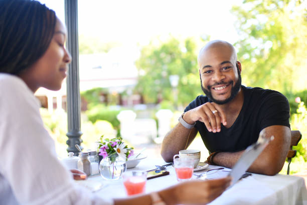 istock Young confident millennial male in a restaurant 1205738904