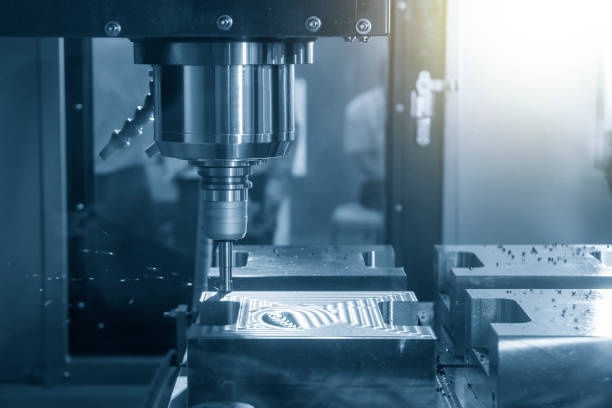 istock The CNC milling machine rough cutting  the injection mold parts by indexable  endmill tools. 1205739054