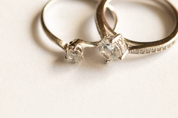 istock Close up of two diamond silver rings 1205739081