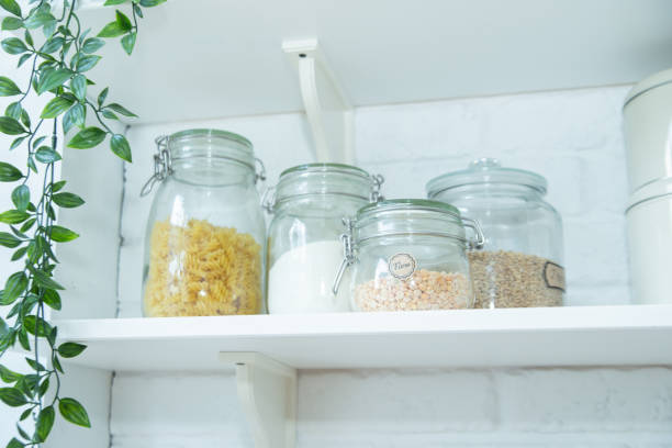 istock Modern kitchen shelves with various food ingredients on white background. 1205739803