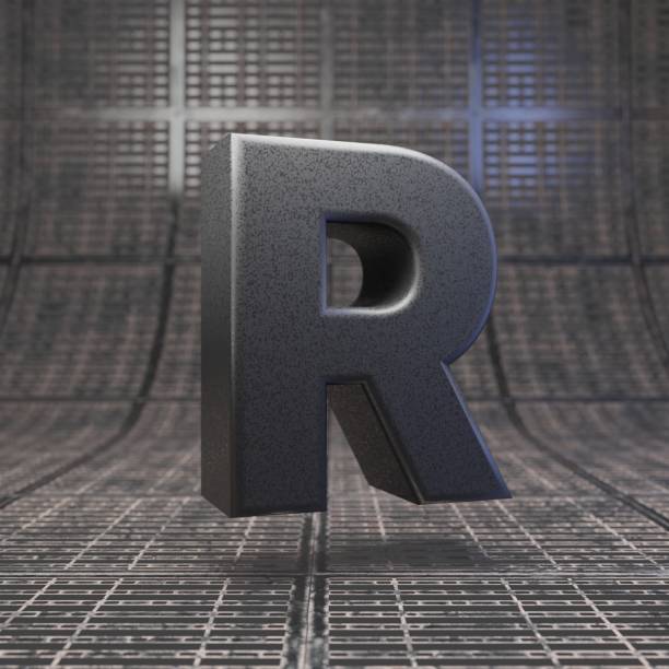 istock Black letter R uppercase. DLSR camera body plastic texture alphabet on metal floor. 1205740635