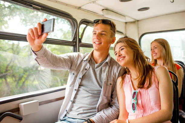 istock smiling couple with smartphone making selfie 1205740839
