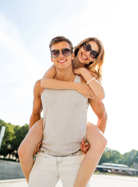 istock smiling couple having fun in city 1205741138