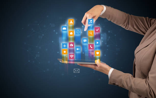 istock Classic application icons coming out from tablet 1205741254