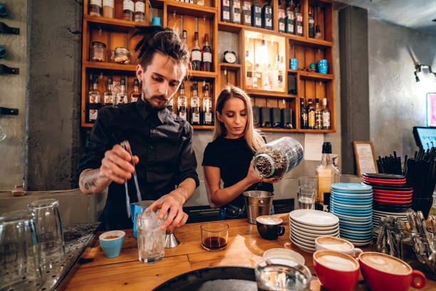 istock Baristas packing coffee 1205741309