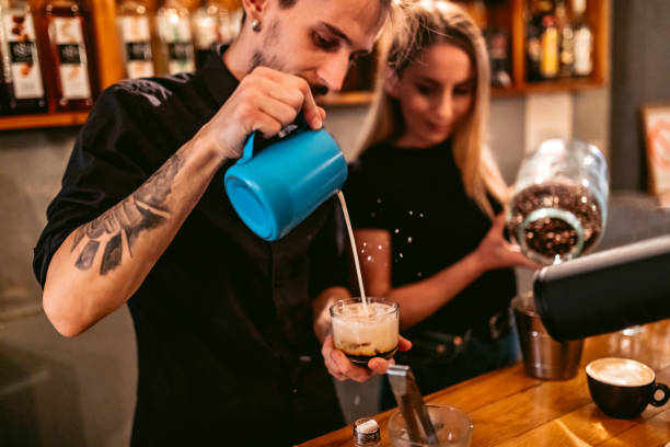 istock Baristas packing coffee 1205741335